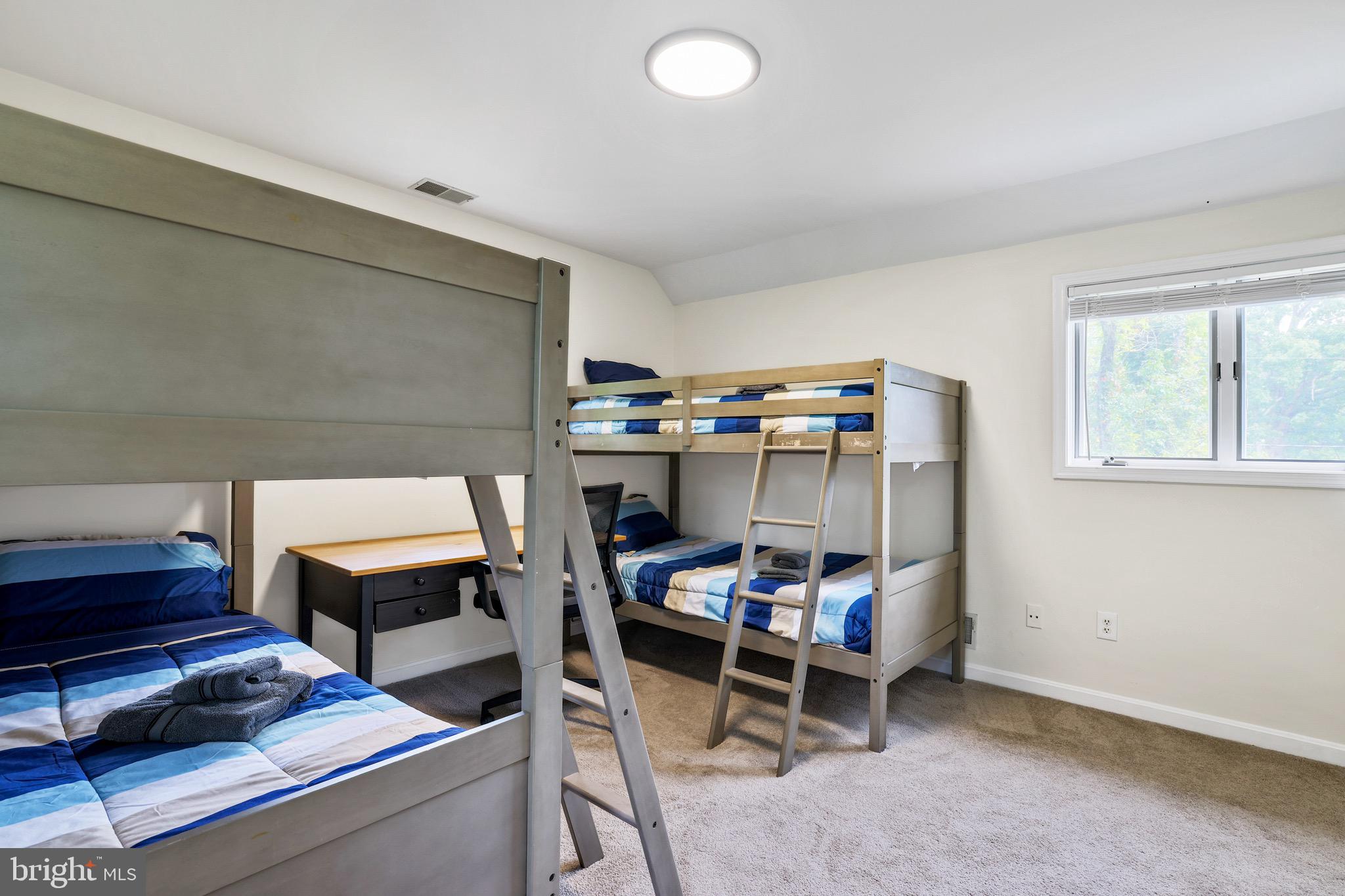 920 Old Annapolis Neck Road Annapolis, MD 21403 - Photo 40 of 58 a bed room with a bed and a desk