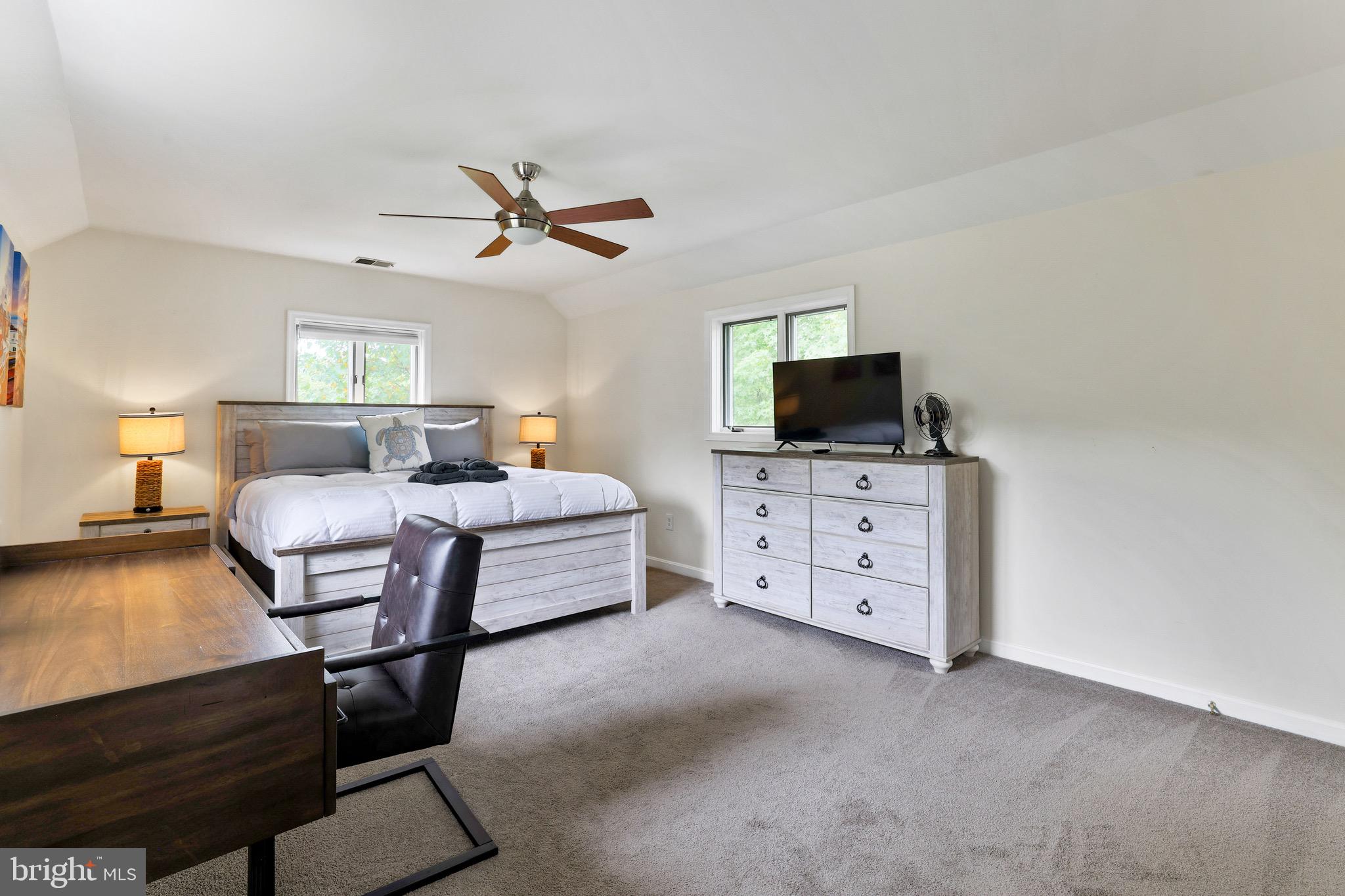 920 Old Annapolis Neck Road Annapolis, MD 21403 - Photo 44 of 58 a bedroom with furniture and a flat screen tv