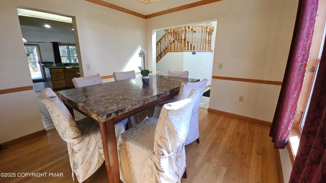 a view of a chairs and table in backyard of the house