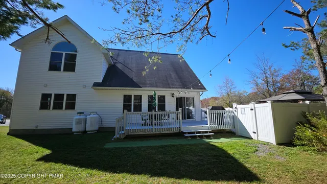 a bedroom with two beds and a window