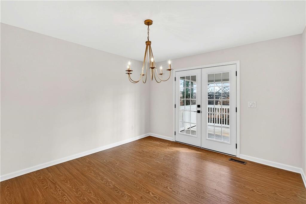 1028 Boston Ridge Woodstock, GA 30189 - Photo 13 of 37 wooden floor in an empty room