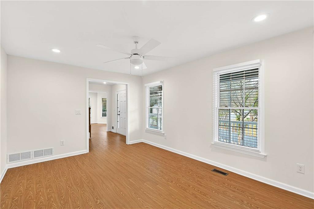 1028 Boston Ridge Woodstock, GA 30189 - Photo 15 of 37 a view of an empty room with a window and wooden floor