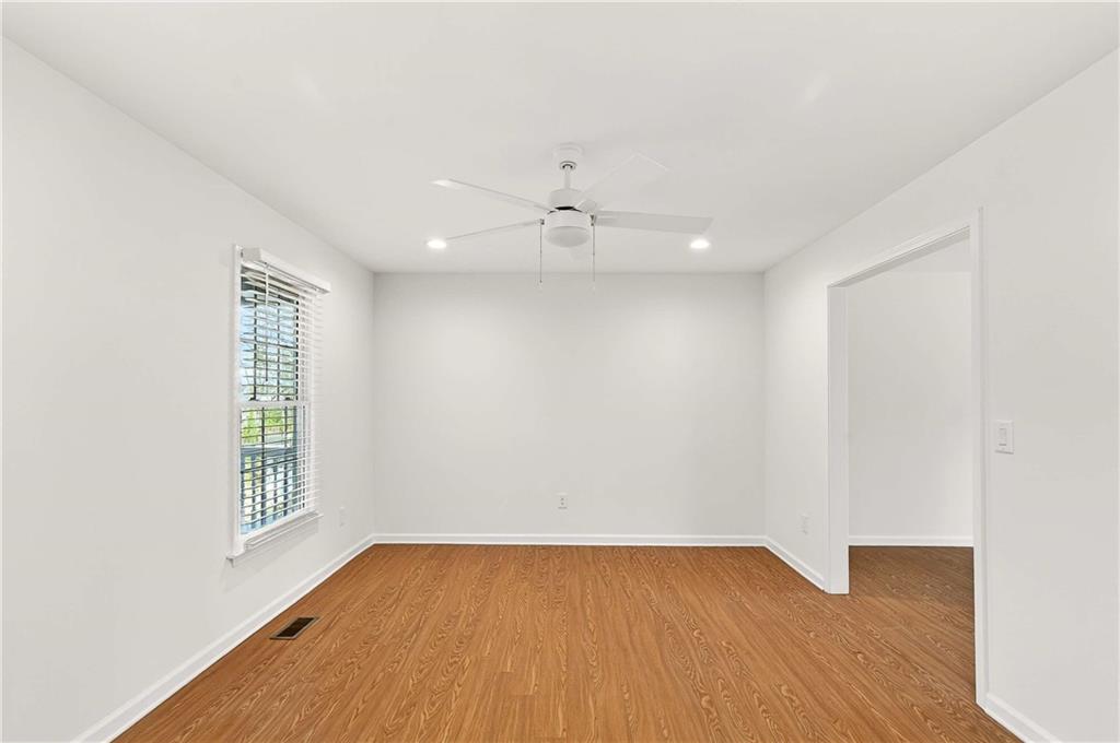 1028 Boston Ridge Woodstock, GA 30189 - Photo 16 of 37 an empty room with a window and a ceiling fan