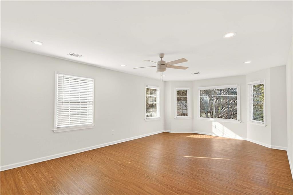 1028 Boston Ridge Woodstock, GA 30189 - Photo 19 of 37 a view of an empty room with wooden floor and a window