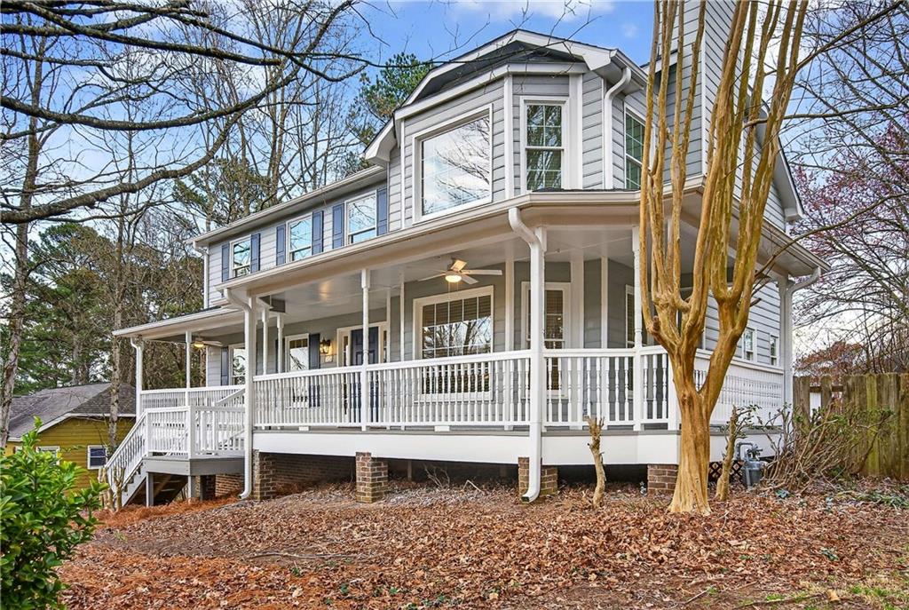 1028 Boston Ridge Woodstock, GA 30189 - Photo 2 of 37 a house view with a garden space