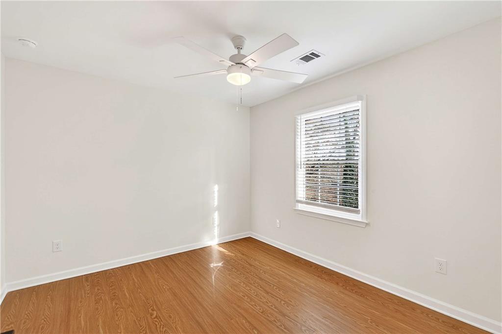 1028 Boston Ridge Woodstock, GA 30189 - Photo 26 of 37 a view of an empty room with wooden floor and a window
