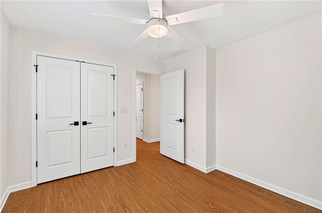 1028 Boston Ridge Woodstock, GA 30189 - Photo 27 of 37 an empty room with wooden floor