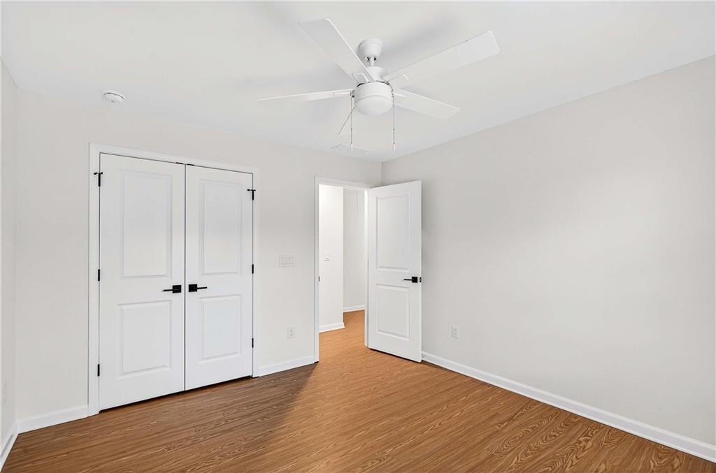 1028 Boston Ridge Woodstock, GA 30189 - Photo 30 of 37 a view of an empty room with wooden floor