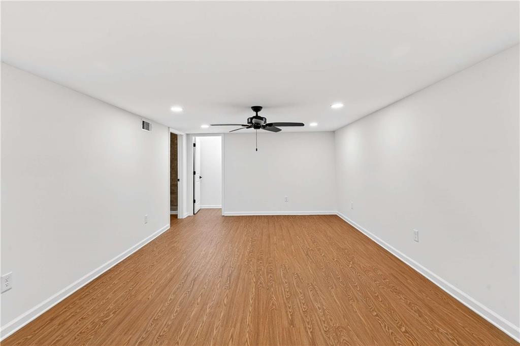 1028 Boston Ridge Woodstock, GA 30189 - Photo 31 of 37 wooden floor in an empty room with a window