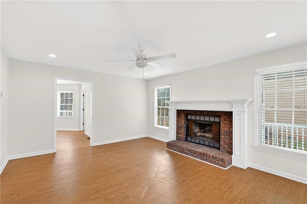1028 Boston Ridge Woodstock, GA 30189 - Photo 5 of 37 a view of an empty room with a fireplace and a window