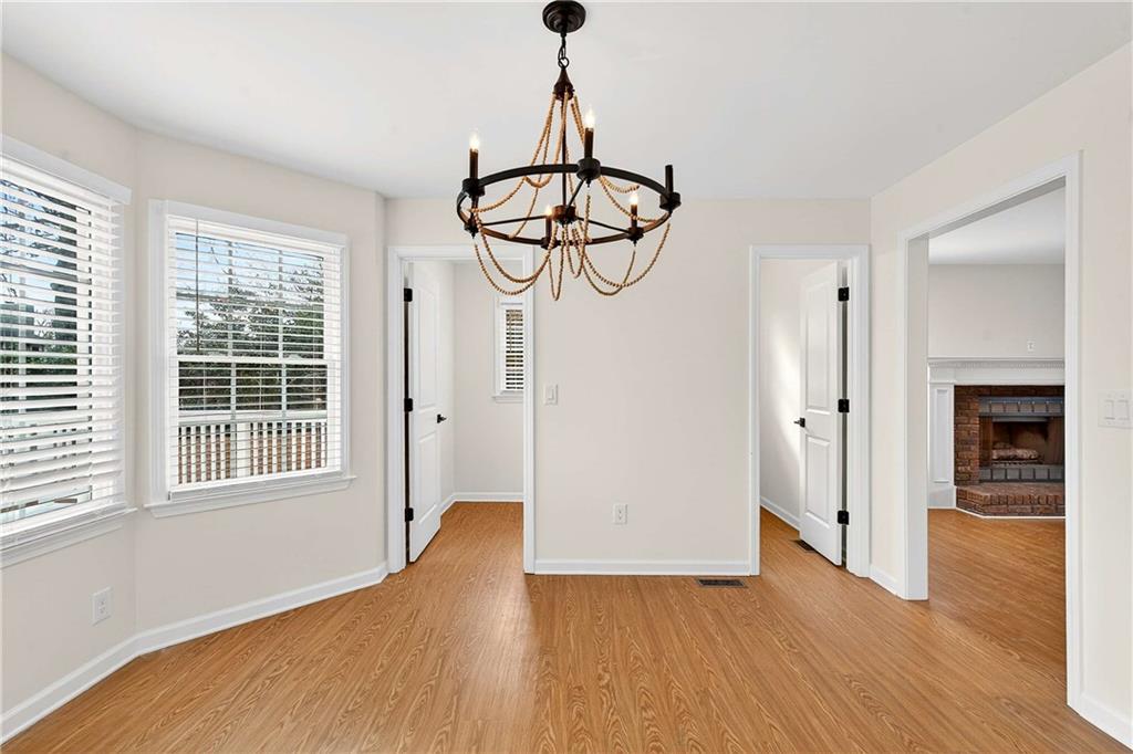 1028 Boston Ridge Woodstock, GA 30189 - Photo 8 of 37 a view of empty room with wooden floor and window