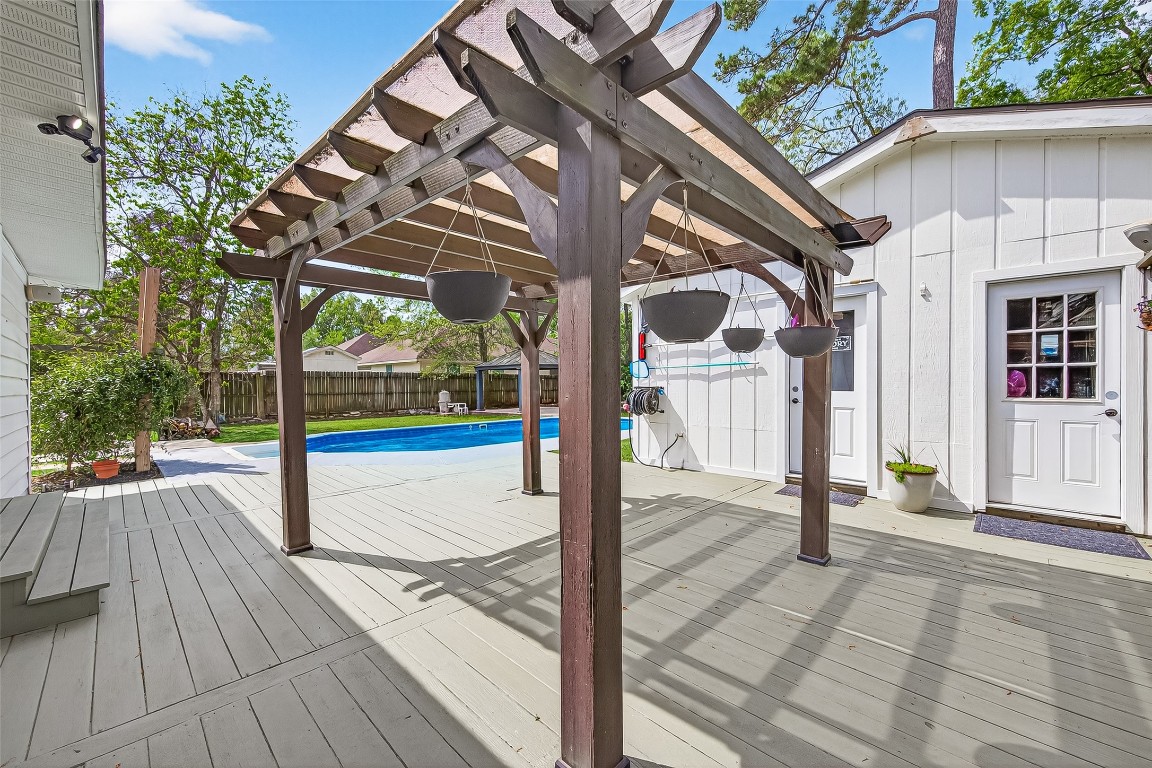 1619 Ashway Street Conroe, TX 77385 - Photo 25 of 40 The deck and pergola provide a great seating area, this is just off the French doors from the primary bedroom.