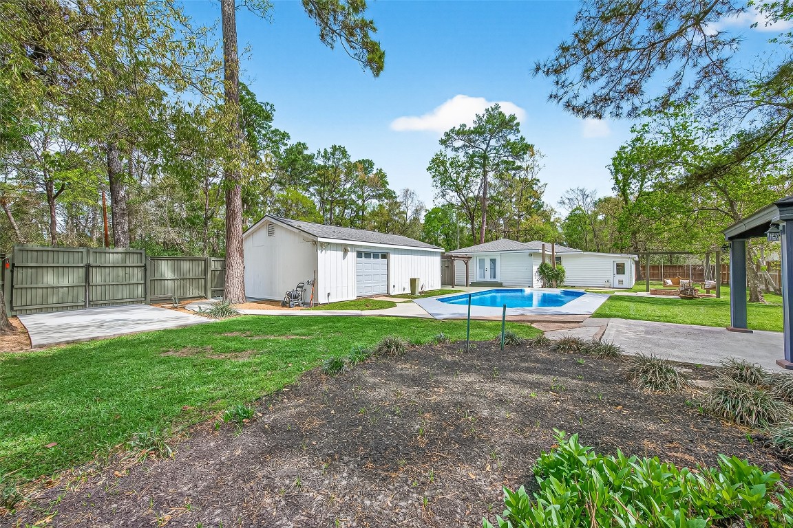 1619 Ashway Street Conroe, TX 77385 - Photo 34 of 40 Secondary driveway extends inside the gate for boat storage