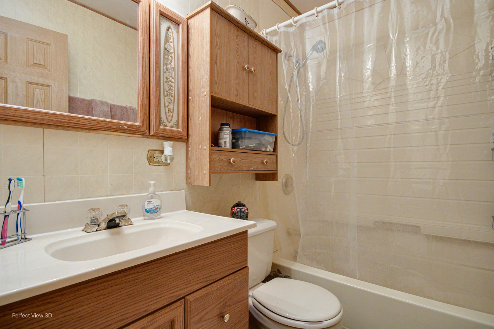 16248 Haven Avenue Orland Hills, IL 60487 - Photo 4 of 10 a bathroom with a sink a toilet and shower curtain