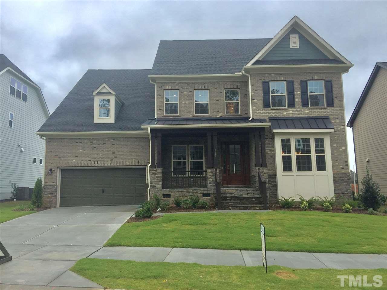 5248 Aleppo Lane, Unit 47 Raleigh, NC 27613 - Photo 1 of 19 a front view of a house with a garden