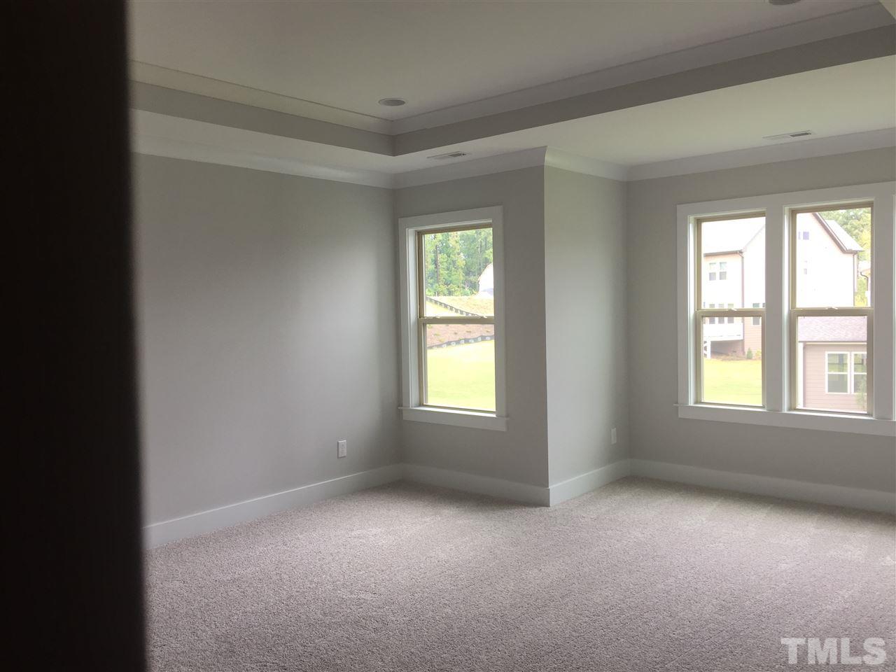 5248 Aleppo Lane, Unit 47 Raleigh, NC 27613 - Photo 17 of 19 an empty room with windows