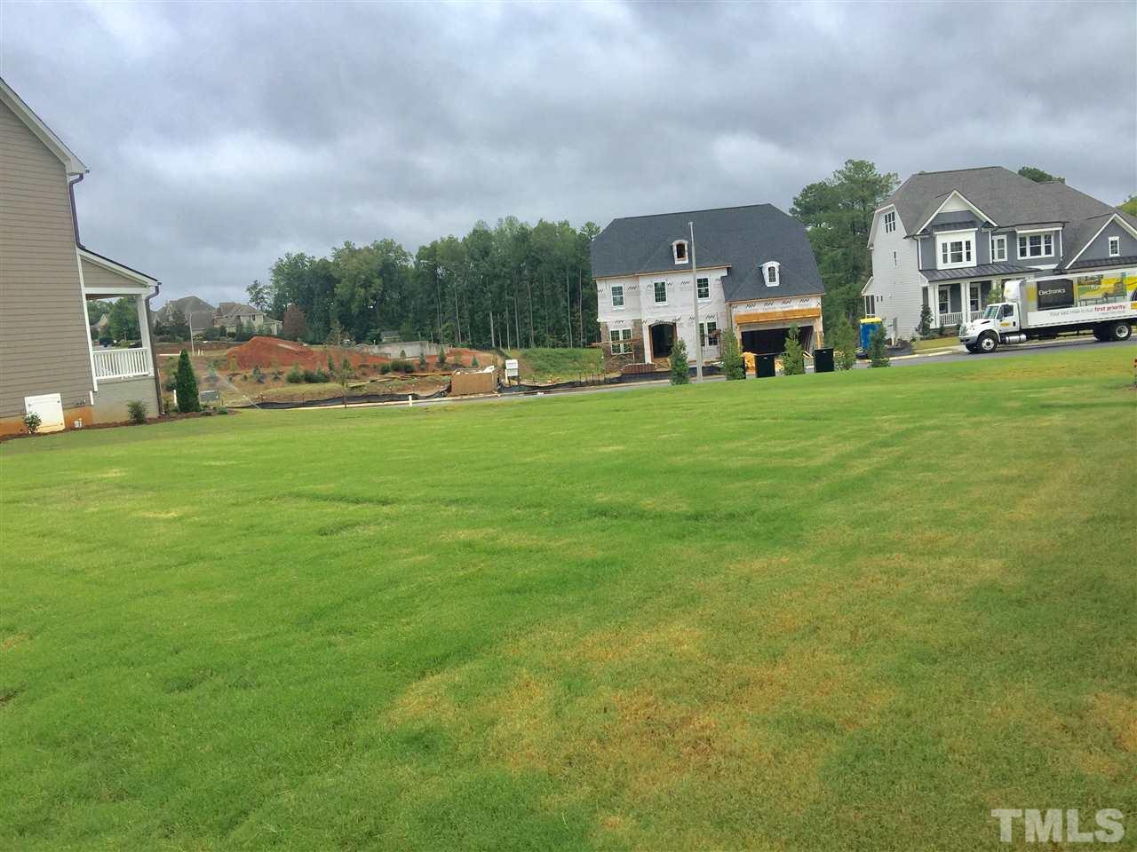 5248 Aleppo Lane, Unit 47 Raleigh, NC 27613 - Photo 4 of 19 a view of a big house with a big yard and large trees