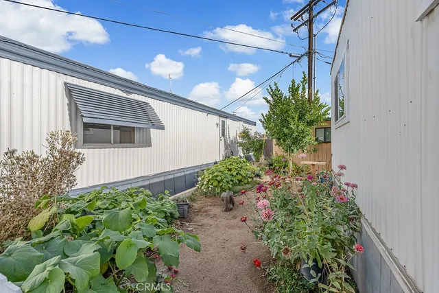 a view of a house with a wooden fence