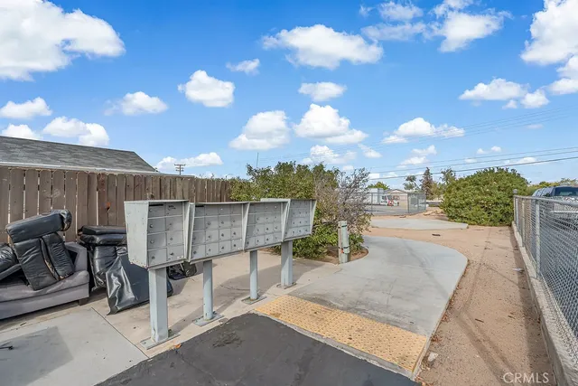 a view of a swimming pool and a yard