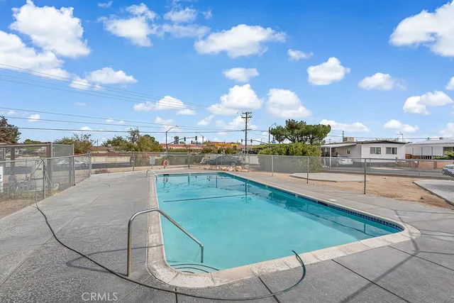 a view of swimming pool from a balcony