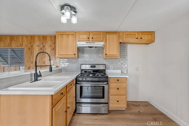 a kitchen with a stove and a sink