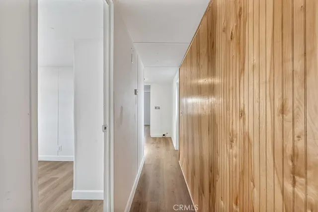 a view of hallway with wooden floor
