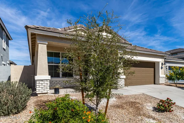 a view of a house with a tree