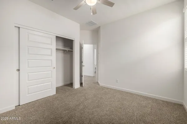 a bathroom with a double vanity sink mirror and toilet