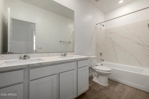 a bathroom with a sink a toilet and a bathtub