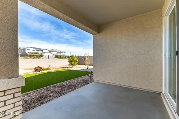 a view of a garden with lawn chairs