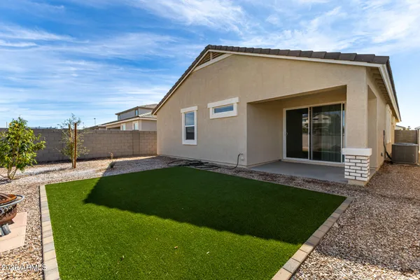 a view of a house with a yard and plants