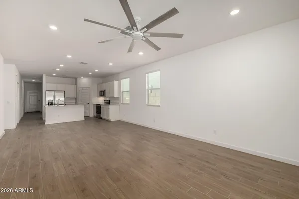 a kitchen with stainless steel appliances a stove microwave and cabinets