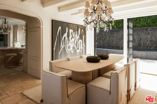 a kitchen with a table and chairs