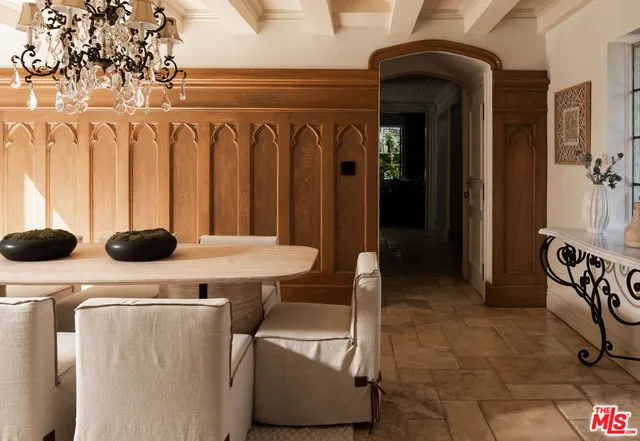 a view of cabinets and dinning table sitting chairs