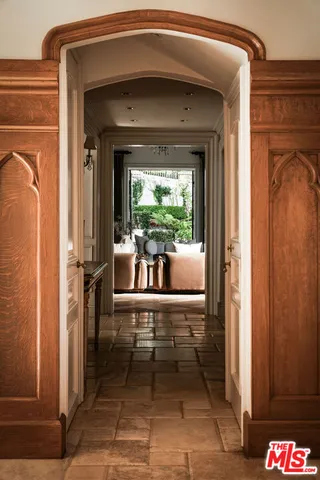 a view of a door and chair in the balcony