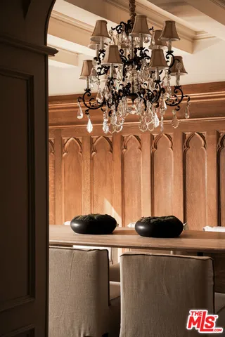 a kitchen with a sink and chandelier