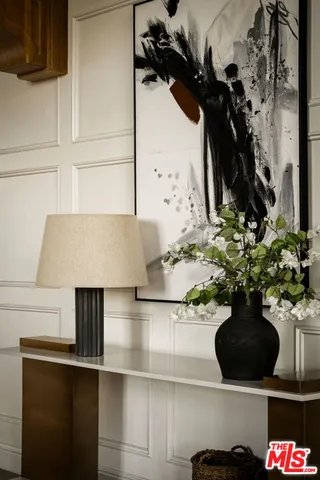 a spacious bathroom with a granite countertop double vanity sink a two mirror a window a bathtub and vanity