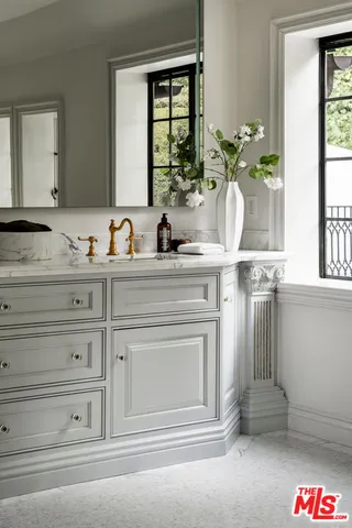 a bathroom with a tub and shower