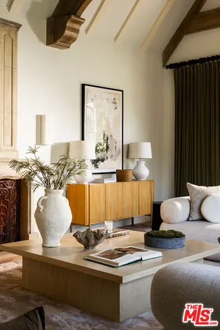 a living room with furniture and large window