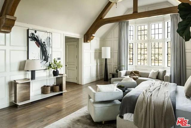 a bedroom with furniture and a fireplace