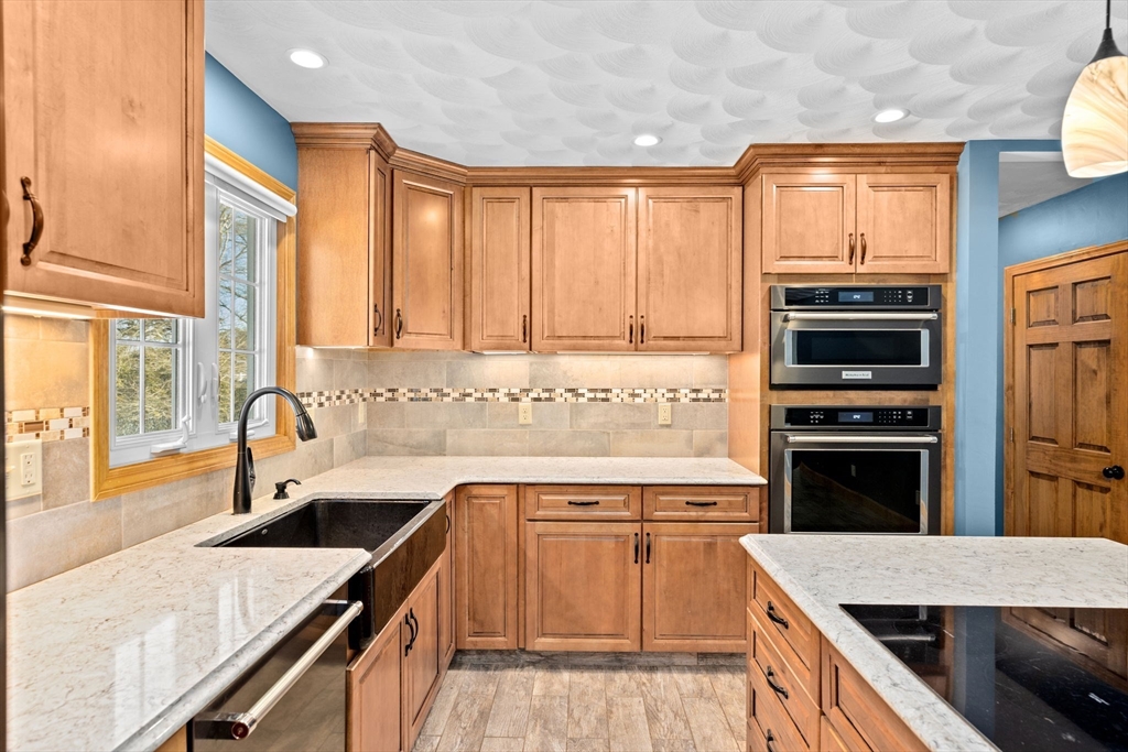 4 Highland Ridge Road Assonet, MA 02702 - Photo 11 of 42 a kitchen with a sink stove top oven and refrigerator