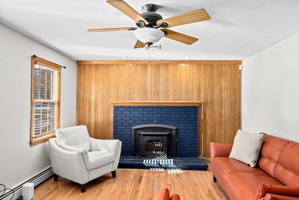 4 Highland Ridge Road Assonet, MA 02702 - Photo 15 of 42 a living room with furniture and a fireplace