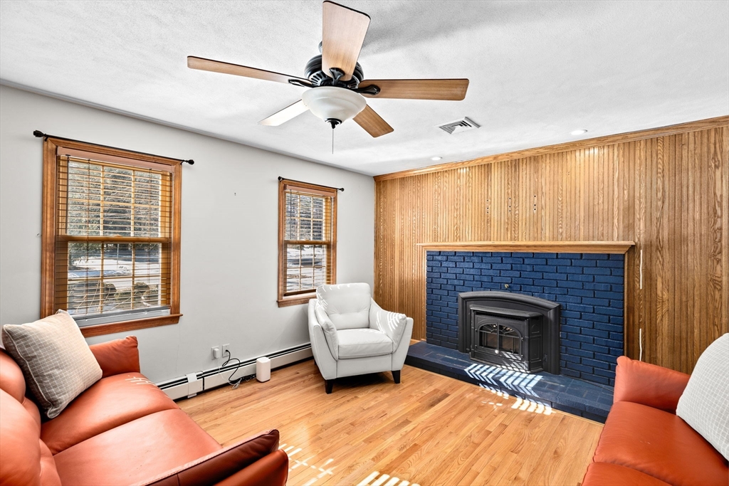 4 Highland Ridge Road Assonet, MA 02702 - Photo 16 of 42 a living room with furniture and a fireplace