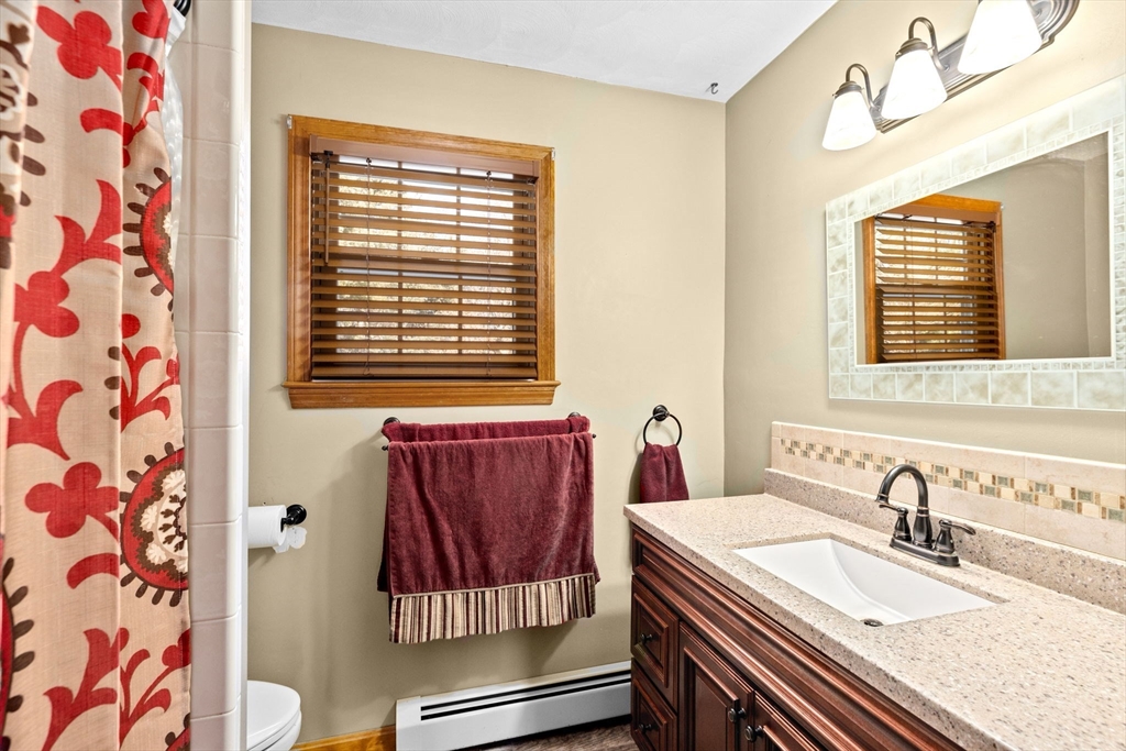 4 Highland Ridge Road Assonet, MA 02702 - Photo 20 of 42 a bathroom with a sink and a mirror