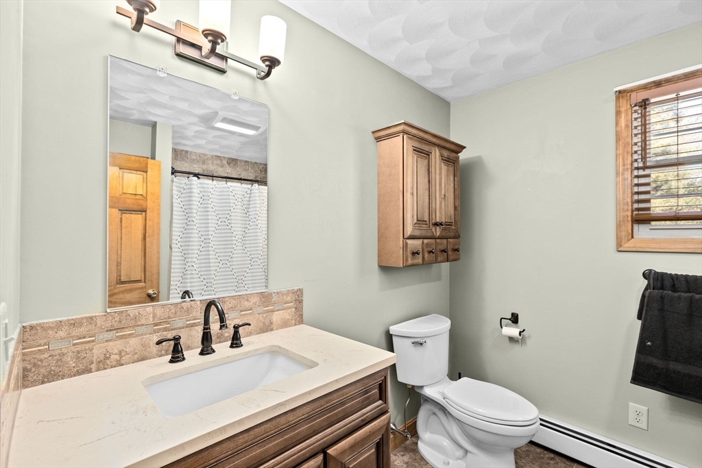 4 Highland Ridge Road Assonet, MA 02702 - Photo 28 of 42 a bathroom with a sink vanity mirror and toilet