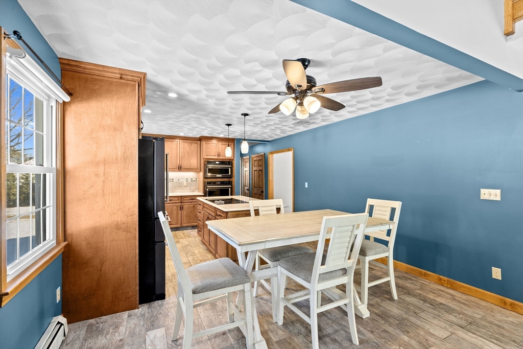 4 Highland Ridge Road Assonet, MA 02702 - Photo 5 of 42 a view of a dining room with furniture window and wooden floor