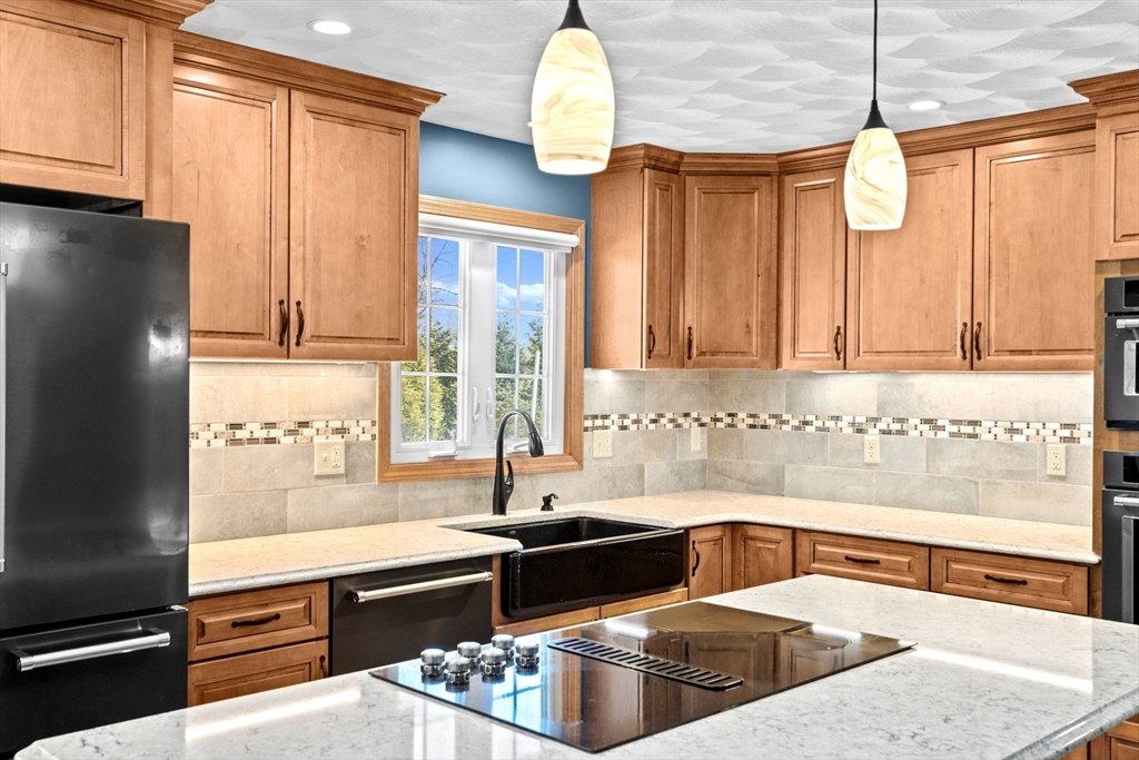 4 Highland Ridge Road Assonet, MA 02702 - Photo 8 of 42 a kitchen with a refrigerator and a sink