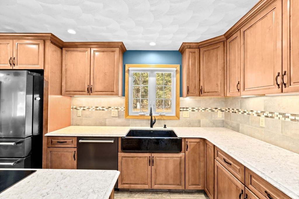 4 Highland Ridge Road Assonet, MA 02702 - Photo 10 of 42 a kitchen with granite countertop a sink and a refrigerator