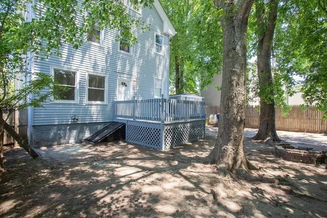 a view of house with a yard