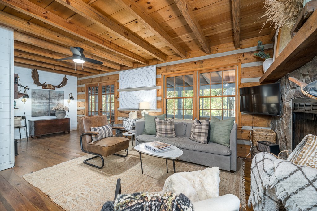 250 Chinkapin Drive Blue Ridge, GA 30513 - Photo 24 of 50 a living room with furniture and a flat screen tv